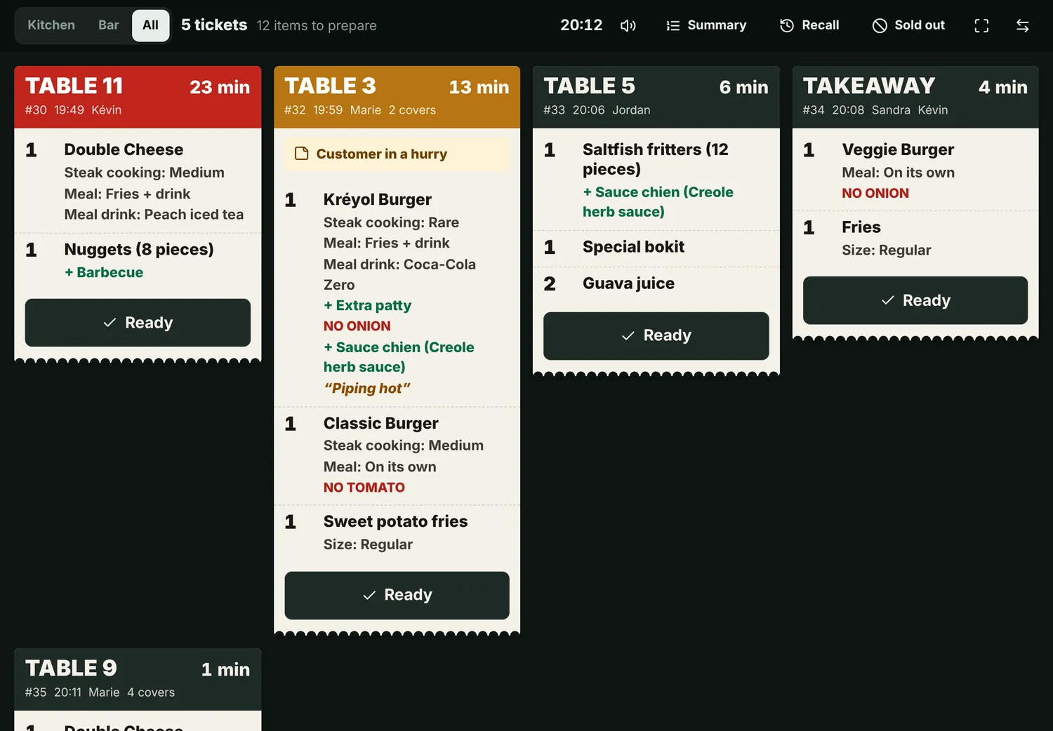 Kitchen screen: table tickets arrive live, with extras and a timer